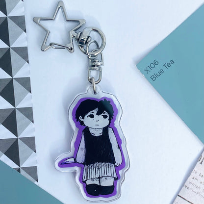 A reversible side of the Sunny keychain showing Omori